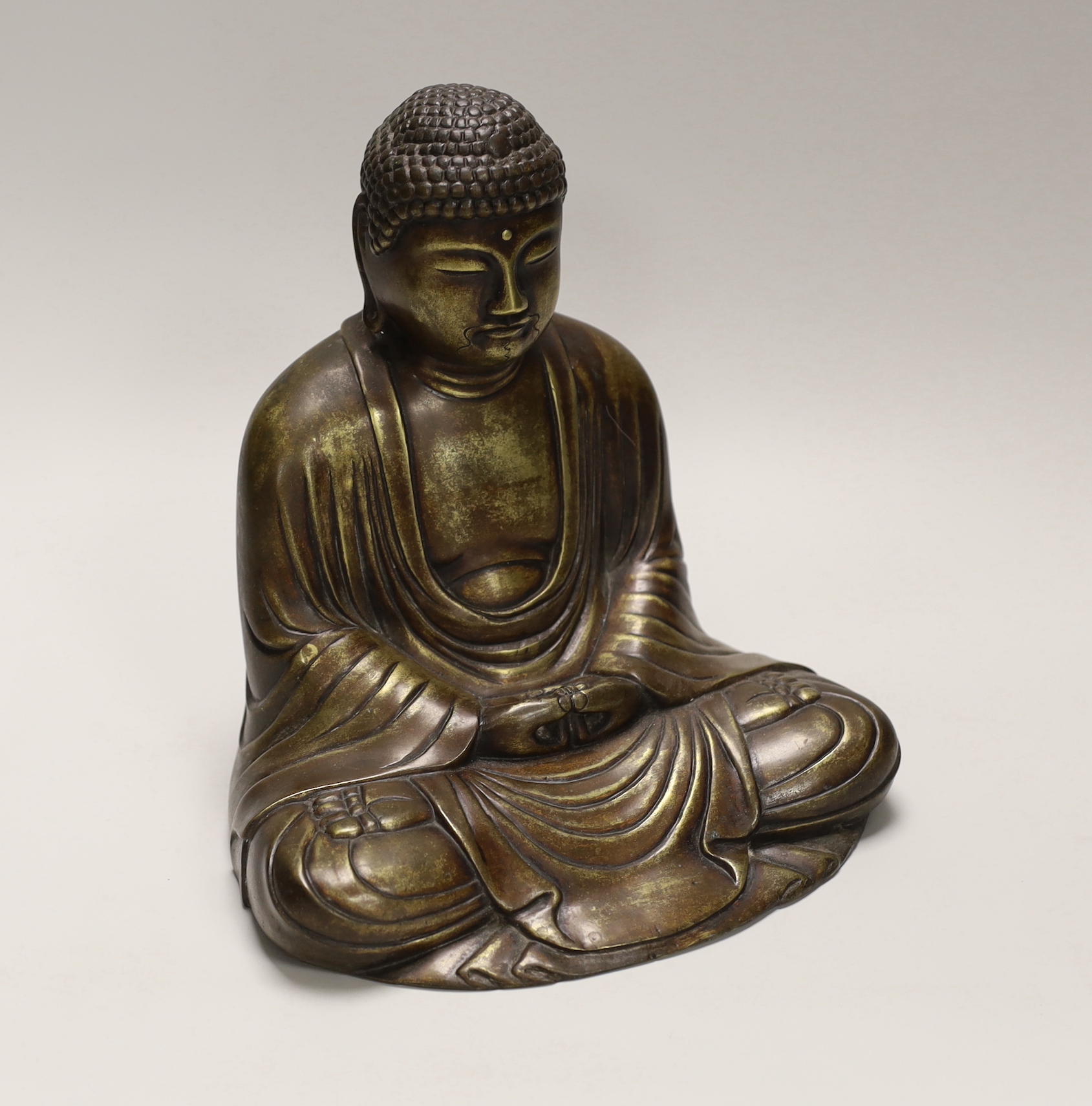 A 20th century bronze model of a seated Buddha, 22cm high